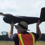 Drone pilot holding unmanned UAV - Early 2010s