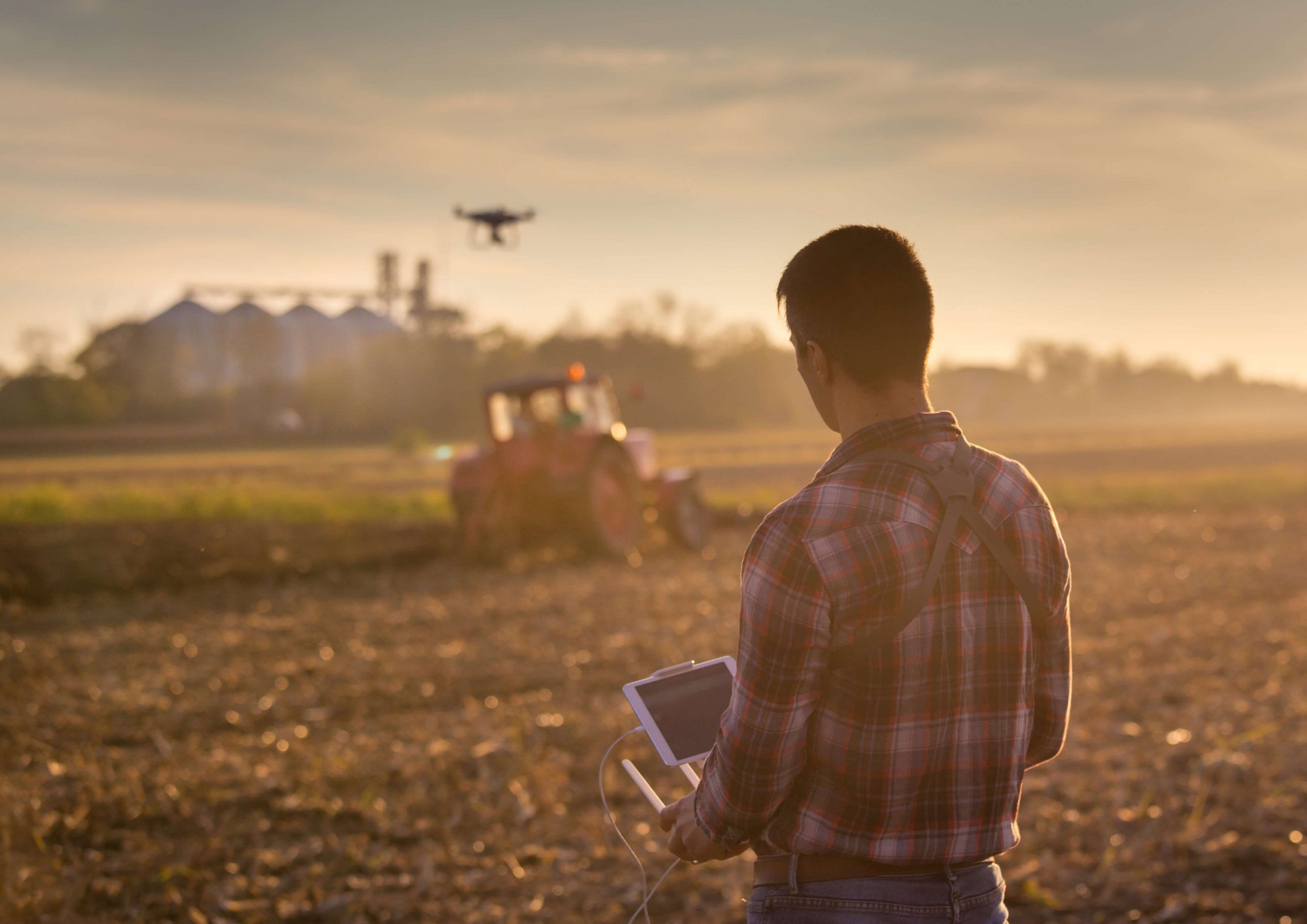 farmer using drone in field for precision agriculture and farm management